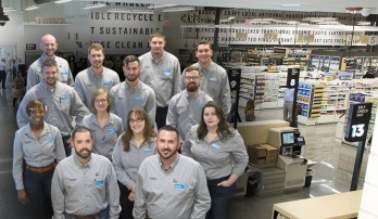 GreenWise Store Managers group photo placed on top of a GreenWise store lobby picture