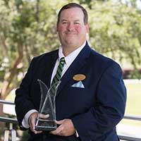 Mr. Craig Leckey-Lone Palm holding his community award