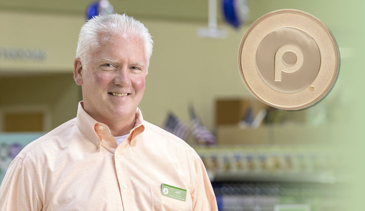 Jeff Toker, Publix gold coin winner stands in the store