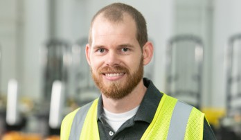 Publix Associate Chris Pitts in his neon yellow safety vest