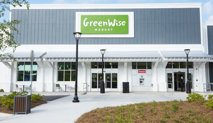 Front view of a GreenWise Market building, GreenWise text on a green background at the top of the building.