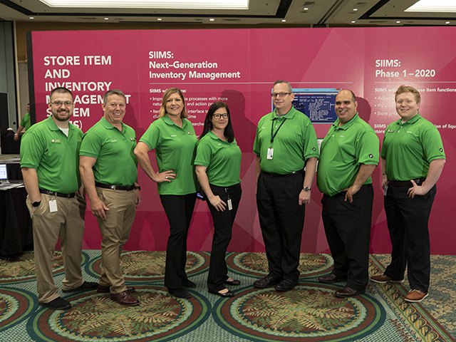 Retail Operations Conference SIIMS team pose in their green polos