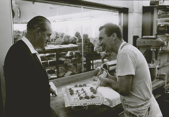 Mr. George with a bakery associate.