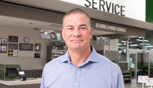 Kevin Murphy in front of a Publix customer service counter